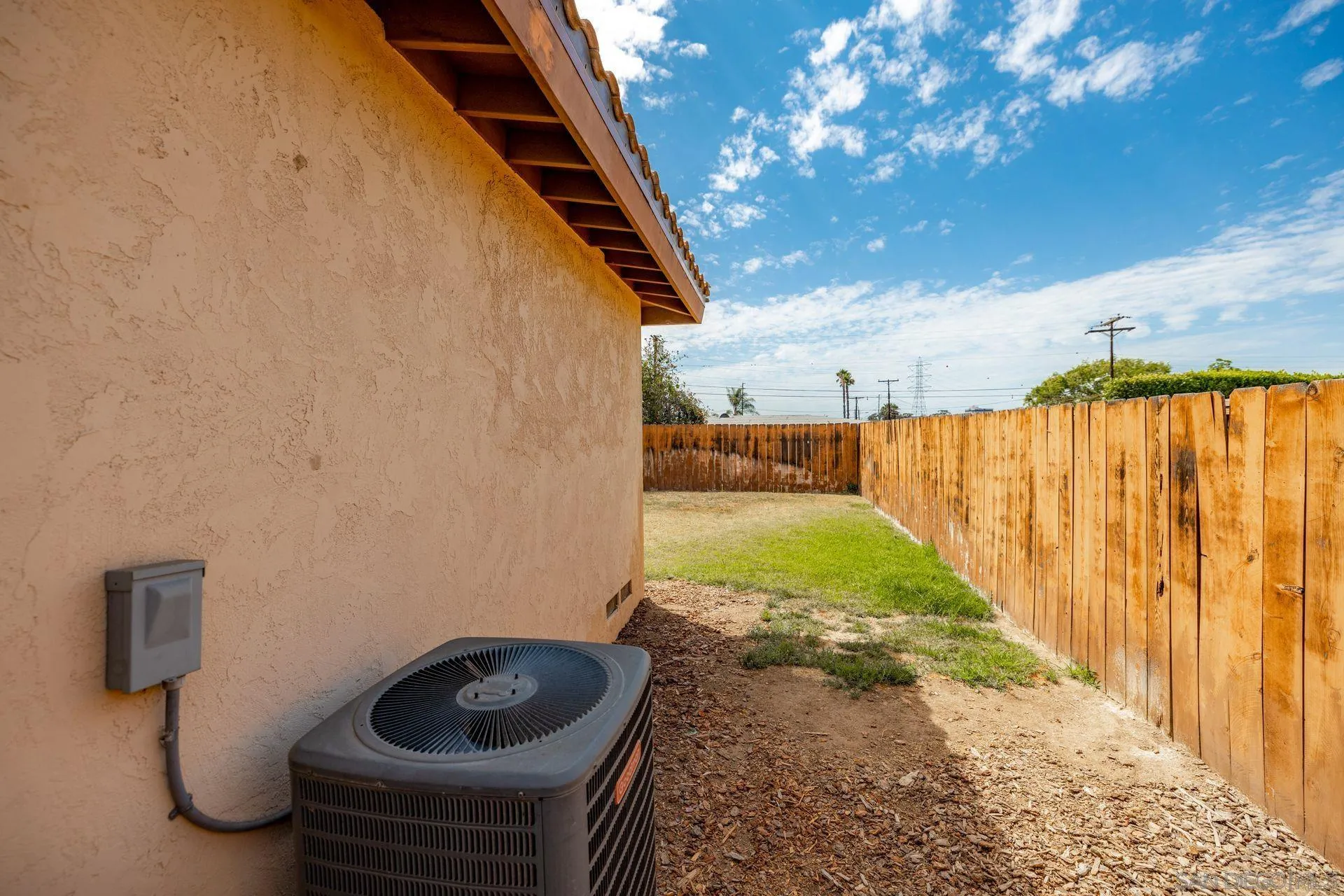 2742 Murray Ridge Road San Diego, CA 92123 - Photo 34 of 34 a backyard of a house with garden and stainless steel appliances