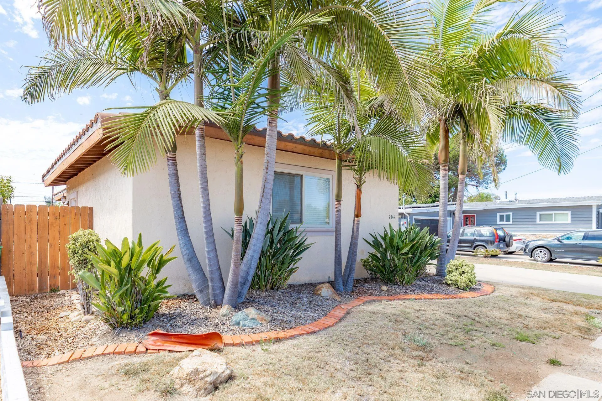 2742 Murray Ridge Road San Diego, CA 92123 - Photo 4 of 34 a view of a backyard with a patio
