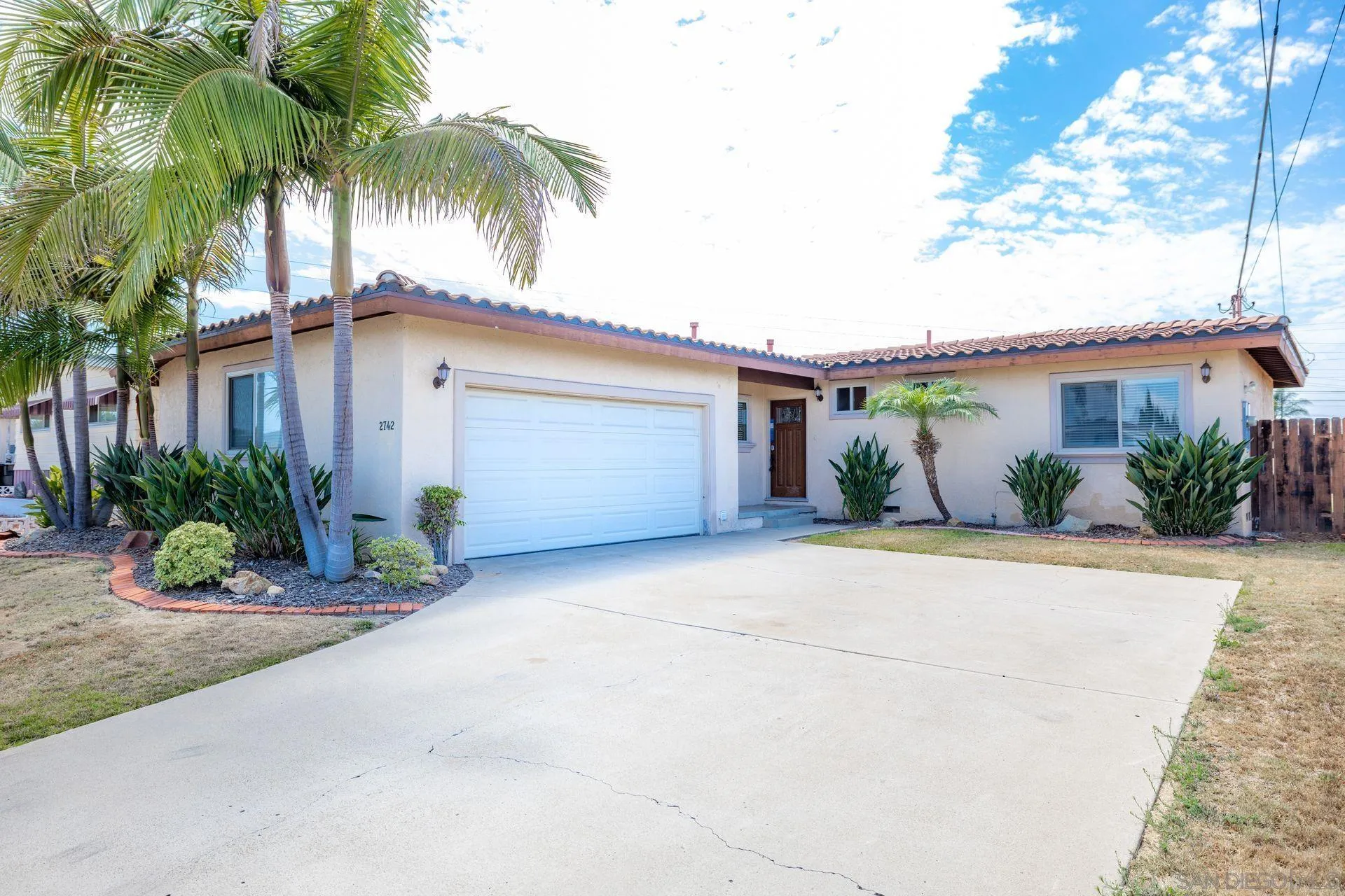 2742 Murray Ridge Road San Diego, CA 92123 - Photo 5 of 34 a view of a house with a patio