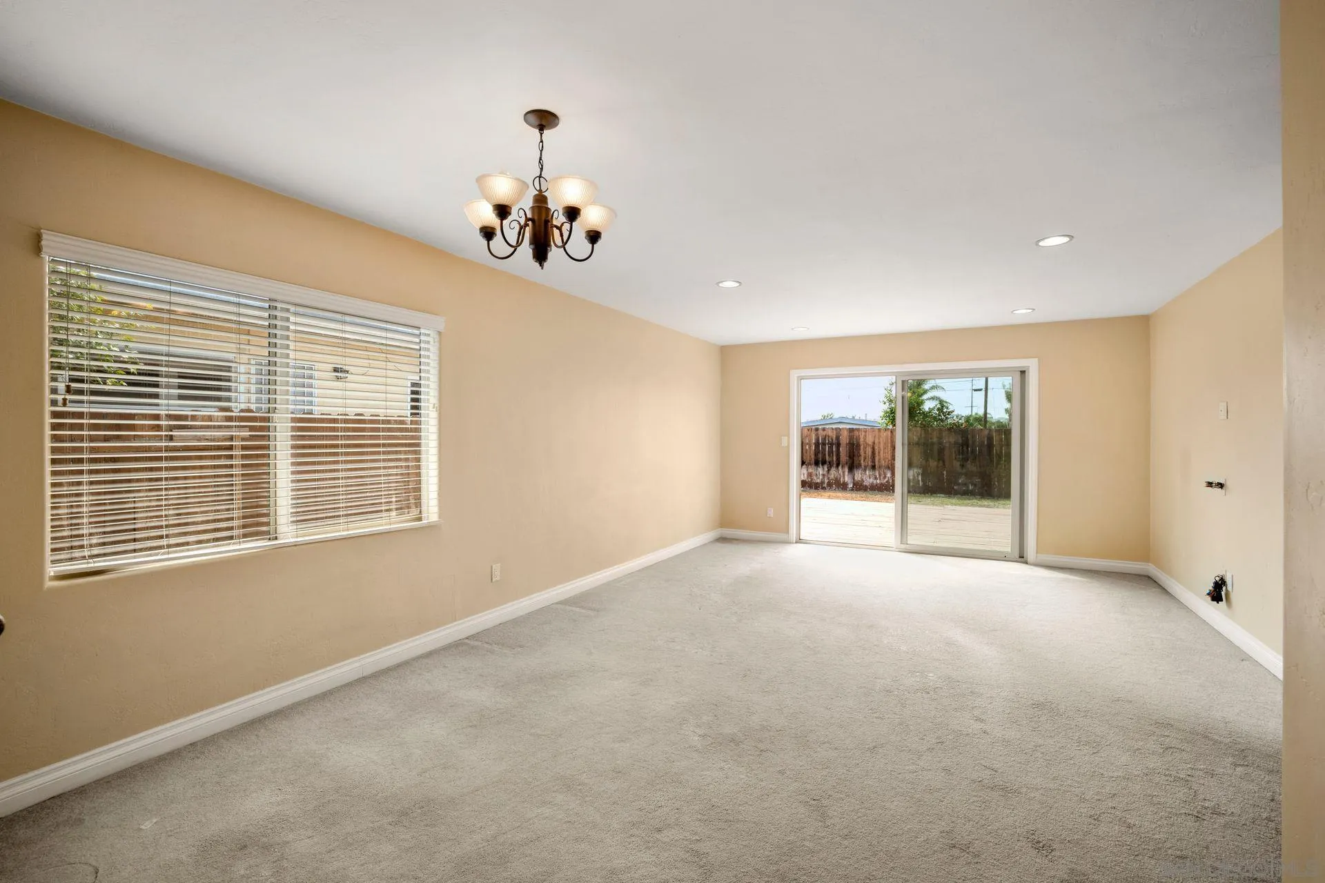 2742 Murray Ridge Road San Diego, CA 92123 - Photo 10 of 34 a view of an empty room with a window