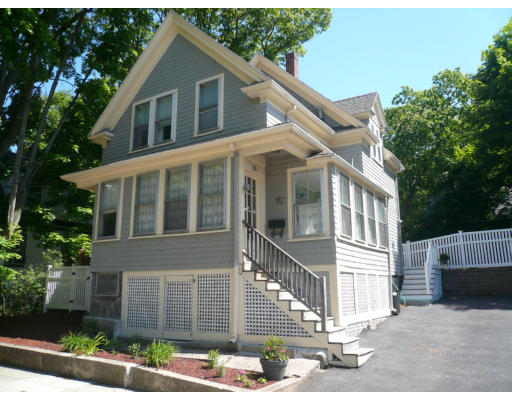 34 Edgemere Road Boston, MA 02132 - Photo 1 of 16 a front view of a house with a yard