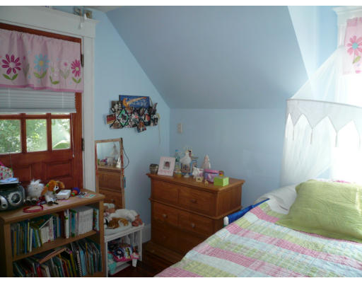 34 Edgemere Road Boston, MA 02132 - Photo 12 of 16 a bedroom with a bed and a window