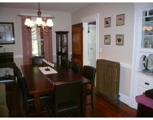 34 Edgemere Road Boston, MA 02132 - Photo 3 of 16 a view of a dining room with furniture and chandelier