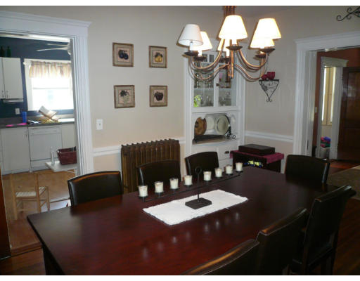 34 Edgemere Road Boston, MA 02132 - Photo 4 of 16 a view of a dining room with furniture and chandelier