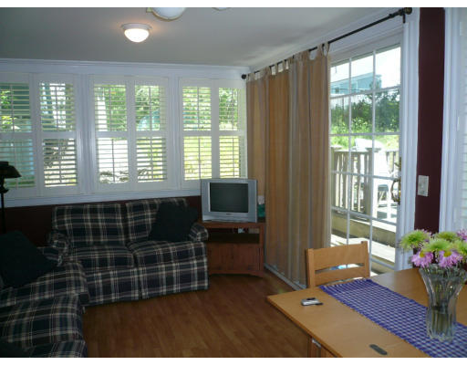 34 Edgemere Road Boston, MA 02132 - Photo 6 of 16 a living room with a large window
