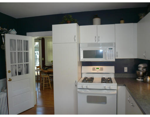 34 Edgemere Road Boston, MA 02132 - Photo 9 of 16 a kitchen with cabinets and appliances