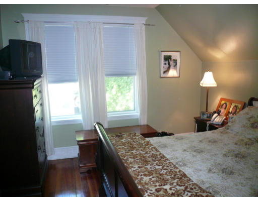 34 Edgemere Road Boston, MA 02132 - Photo 10 of 16 a bedroom with a bed and a television