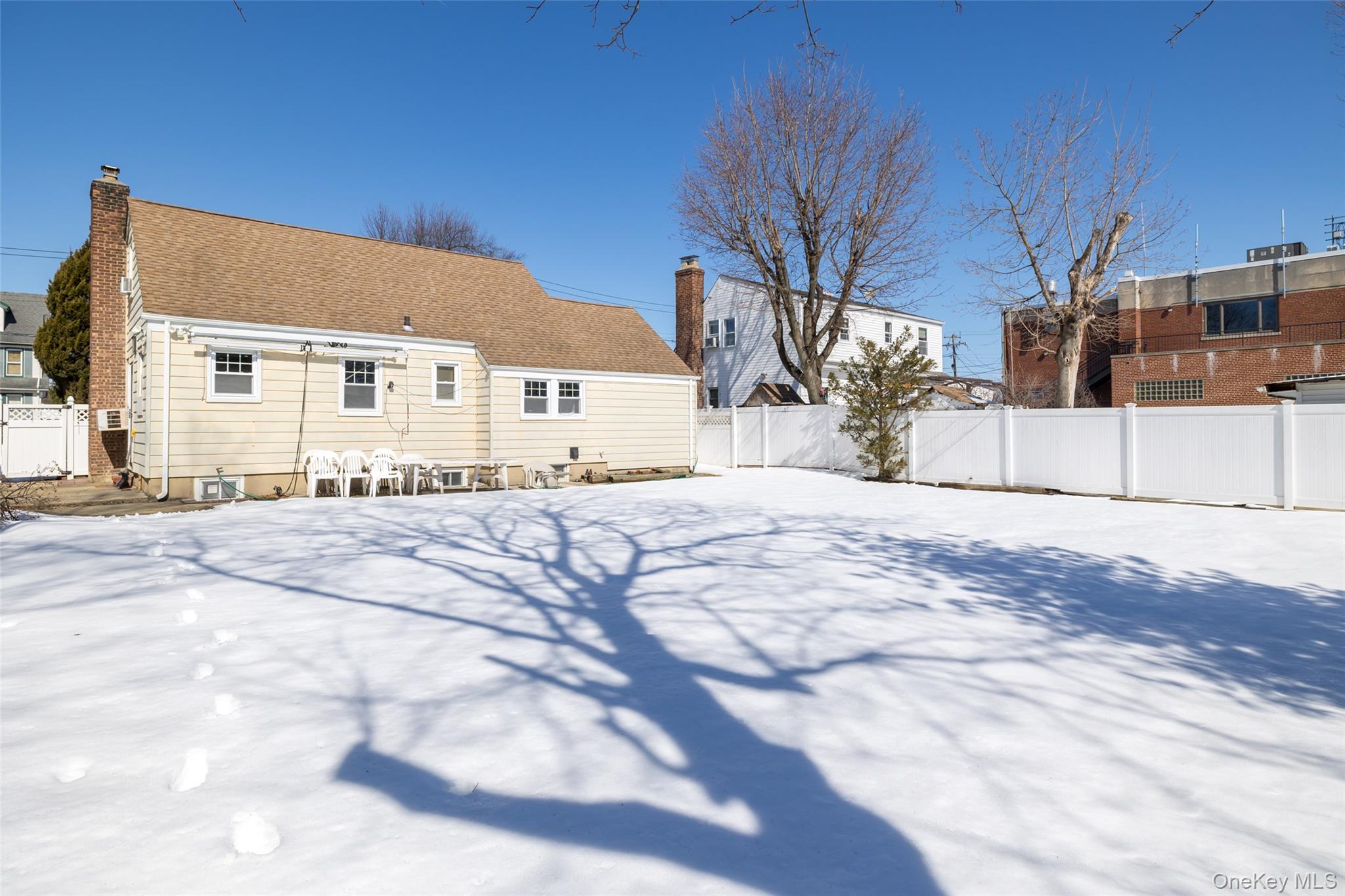 682 Rose Boulevard Baldwin, NY 11510 - Photo 20 of 22 a view of a house with snow on the road