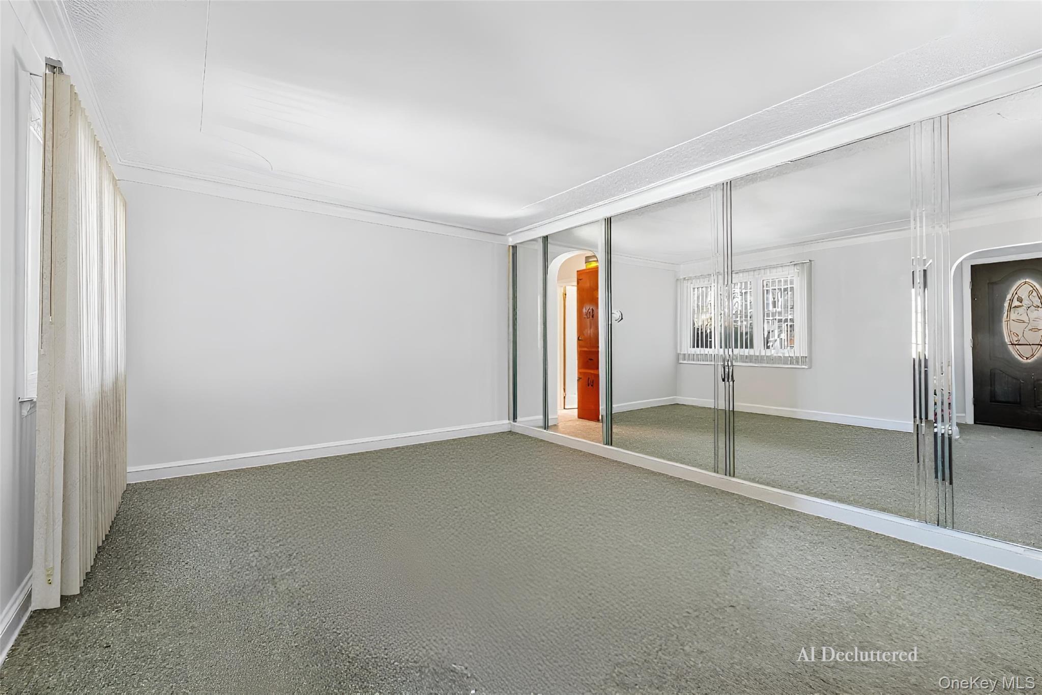 682 Rose Boulevard Baldwin, NY 11510 - Photo 4 of 22 an empty room with a empty space and windows