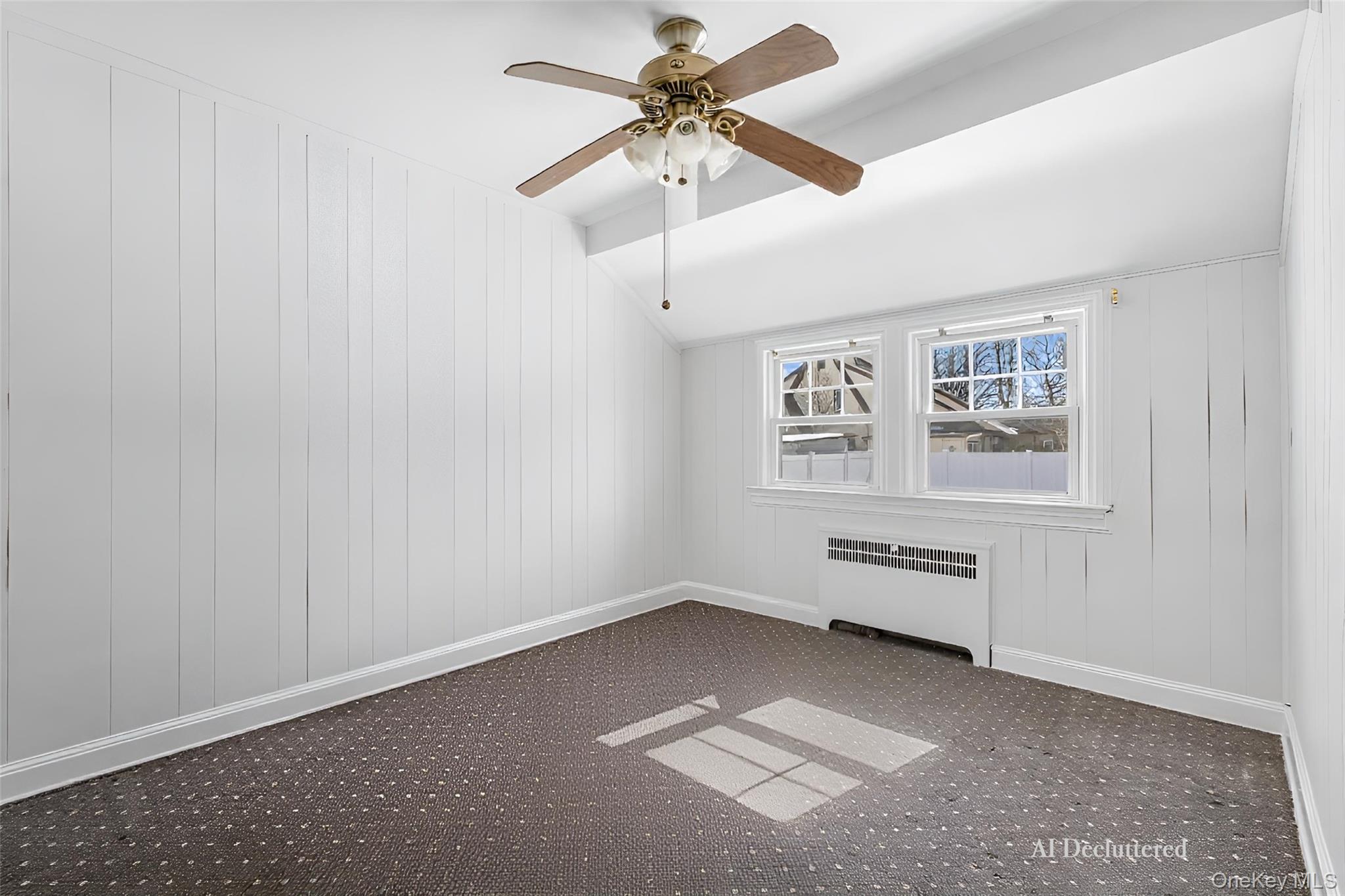 682 Rose Boulevard Baldwin, NY 11510 - Photo 10 of 22 an empty room with windows and fan