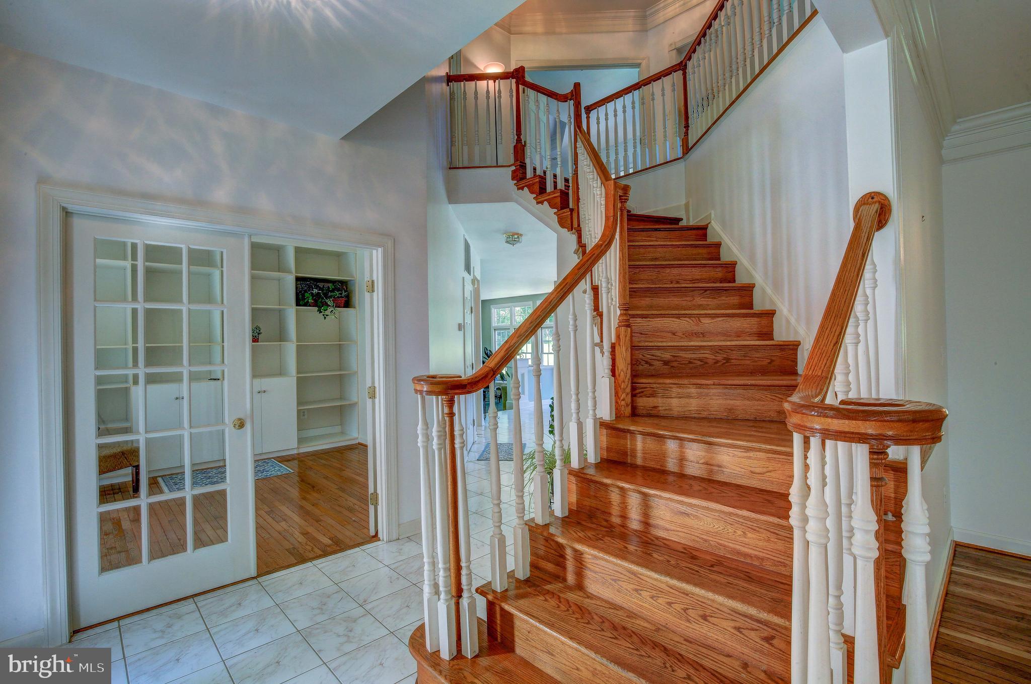 2023 Gresham Lane Davidsonville, MD 21035 - Photo 28 of 58 Graceful curved staircase