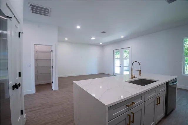 a kitchen with a sink and a refrigerator