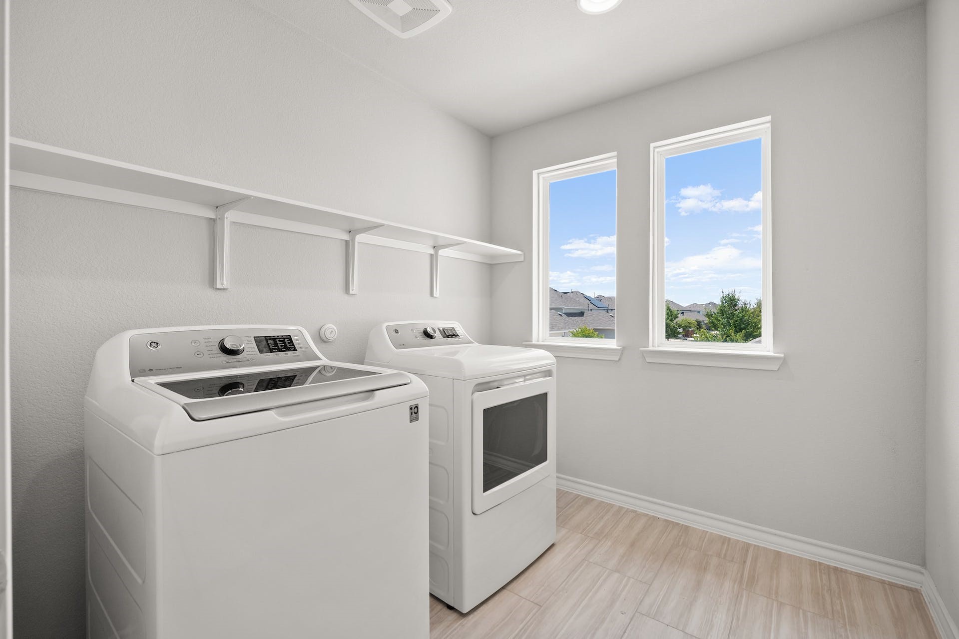 5107 Lemon Tree Path, Unit 127 Austin, TX 78723 - Photo 32 of 40 a utility room with dryer and washer
