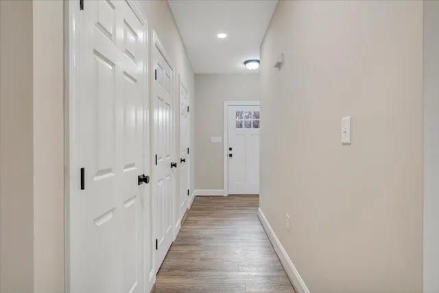 a house that has a tree in front of the house