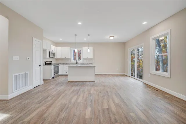 a view of kitchen and wooden floor