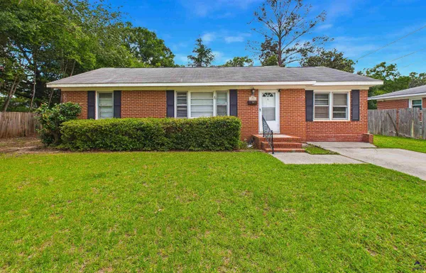 front view of a house with a yard