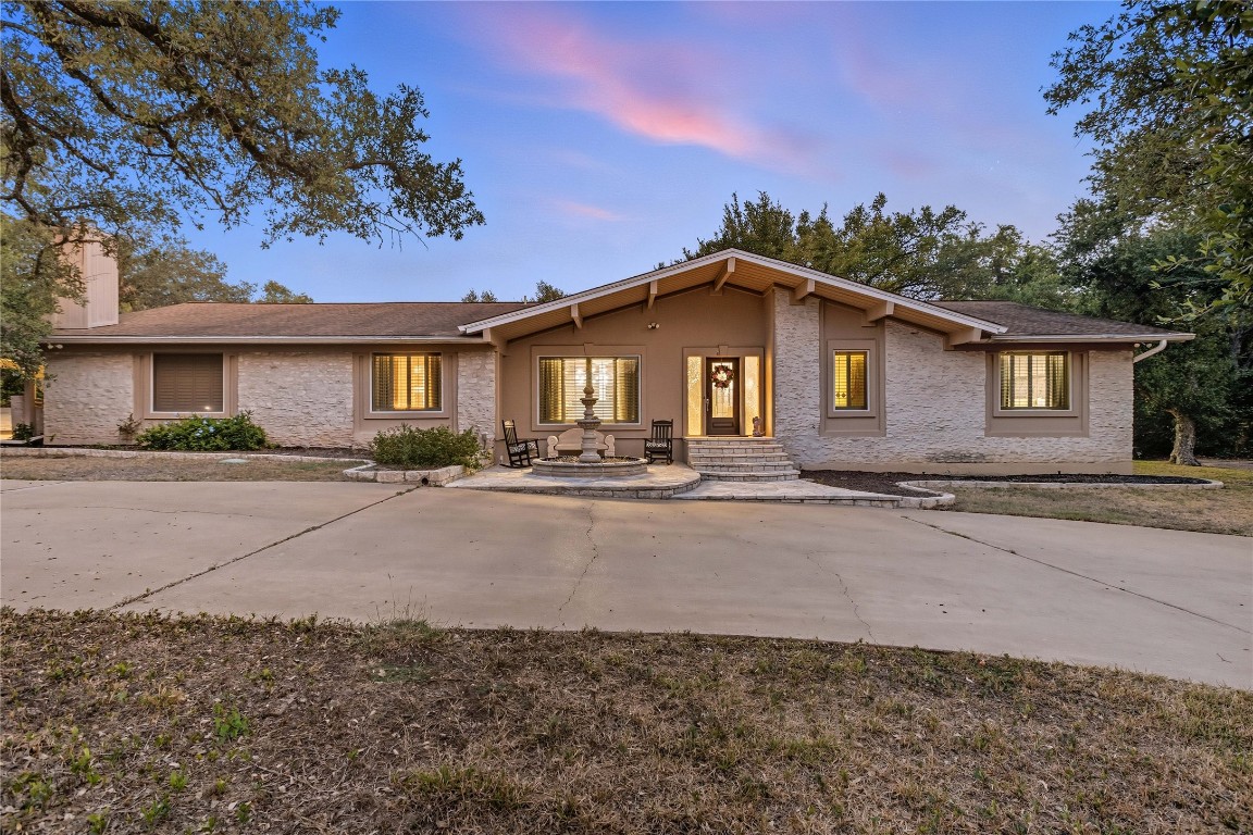 11405 Antler Lane Austin, TX 78726 - Photo 27 of 29 a front view of a house with a yard and outdoor seating