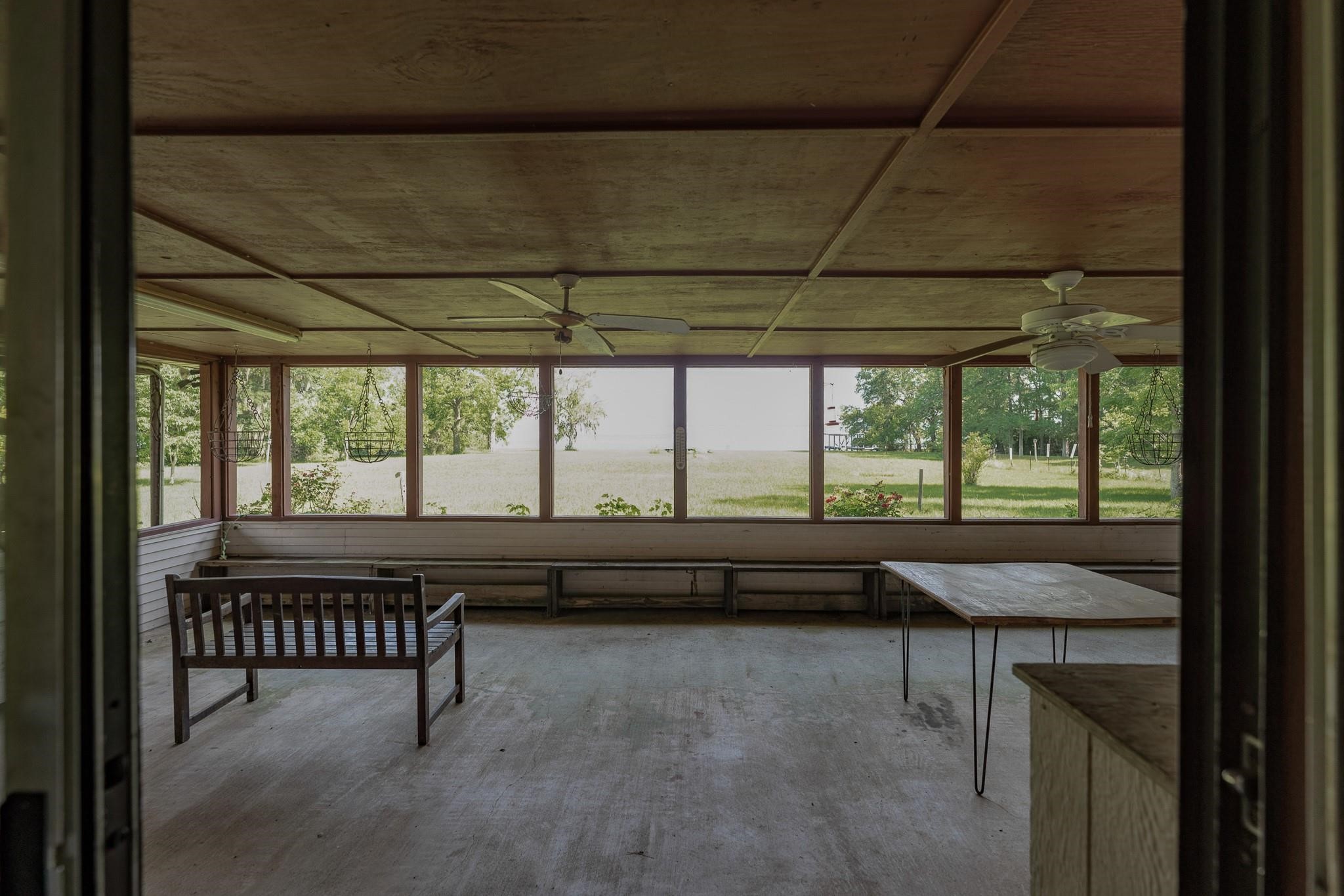 980 Hill Farm Road Coldspring, TX 77331 - Photo 7 of 22 front porch view of lake