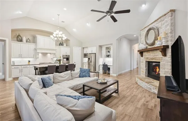 a living room with furniture a fireplace