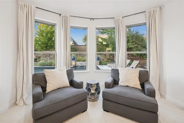 a living room with furniture and a window