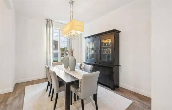 a dining room with furniture and window