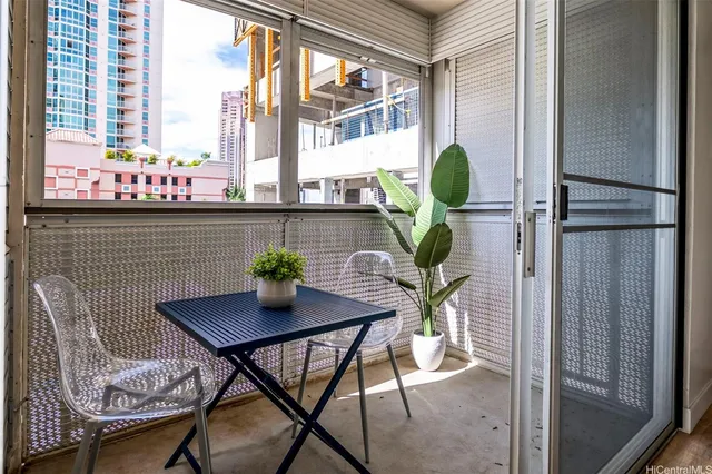 a view of a dining room with furniture window and outside view
