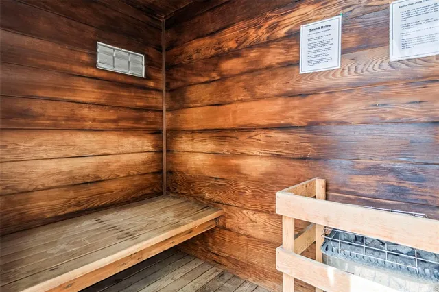 a view of a balcony with wooden floor and brick walls