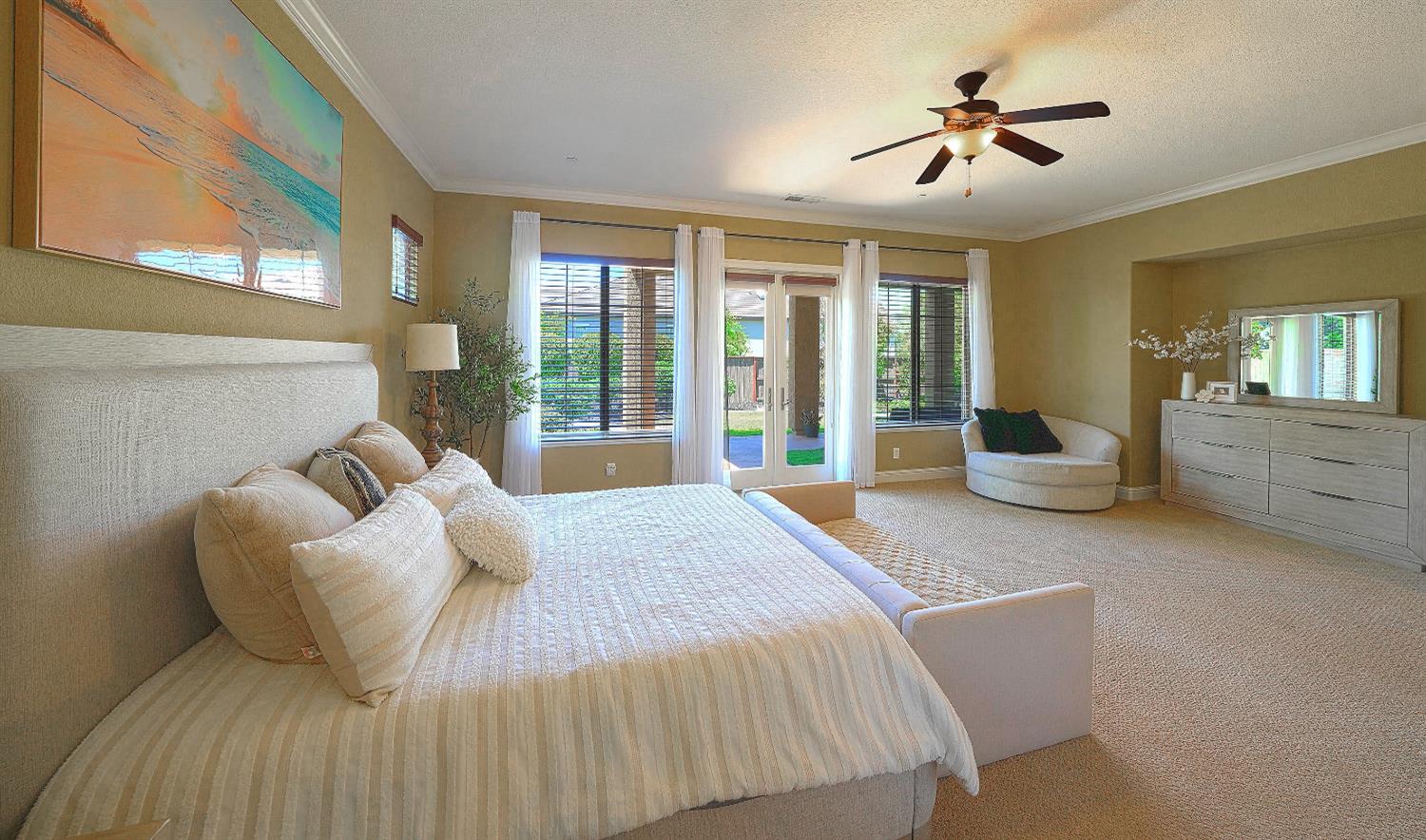 1340 Bella Circle Lincoln, CA 95648 - Photo 19 of 97 a bedroom with a large bed couch and windows