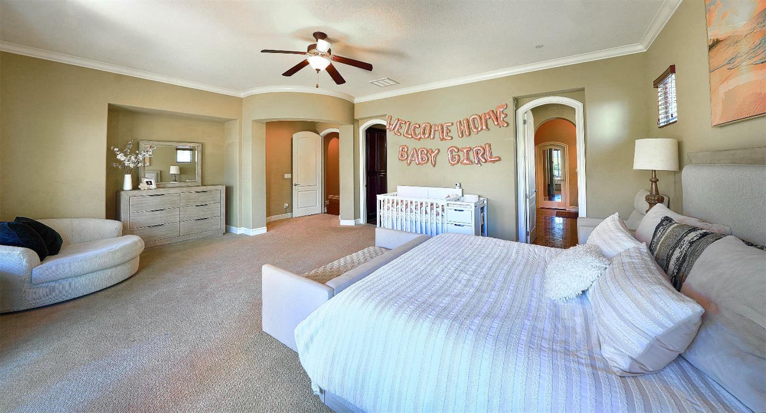 1340 Bella Circle Lincoln, CA 95648 - Photo 20 of 97 a spacious bedroom with a bed and ceiling fan