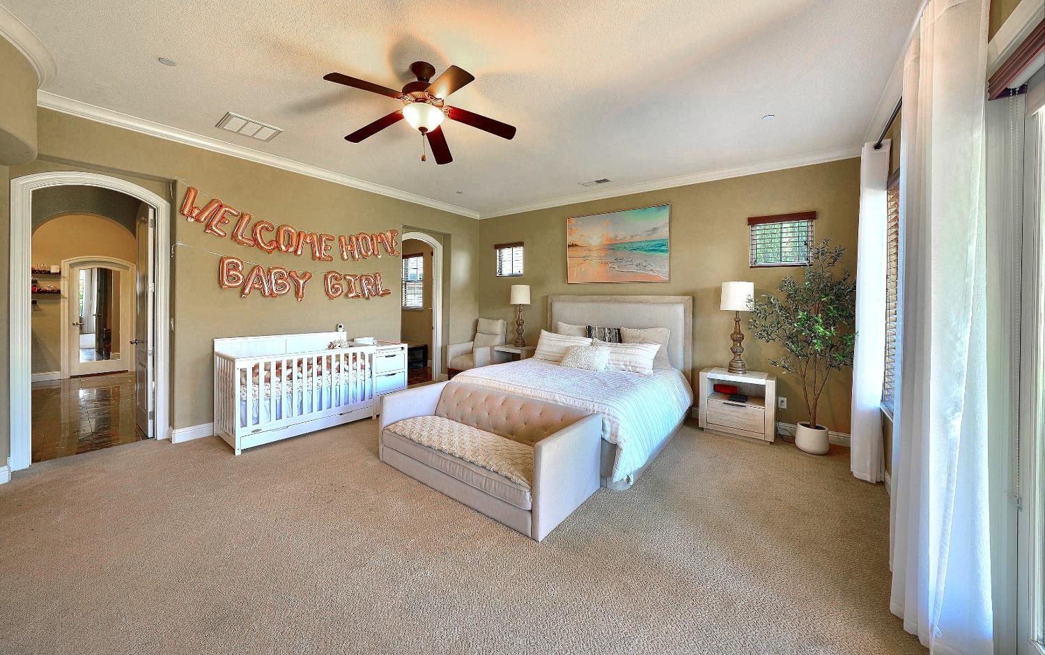 1340 Bella Circle Lincoln, CA 95648 - Photo 21 of 97 a bed room with a bed and a chandelier