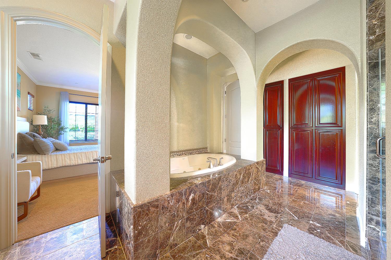 1340 Bella Circle Lincoln, CA 95648 - Photo 22 of 97 a spacious bedroom with a bed and a view of living room