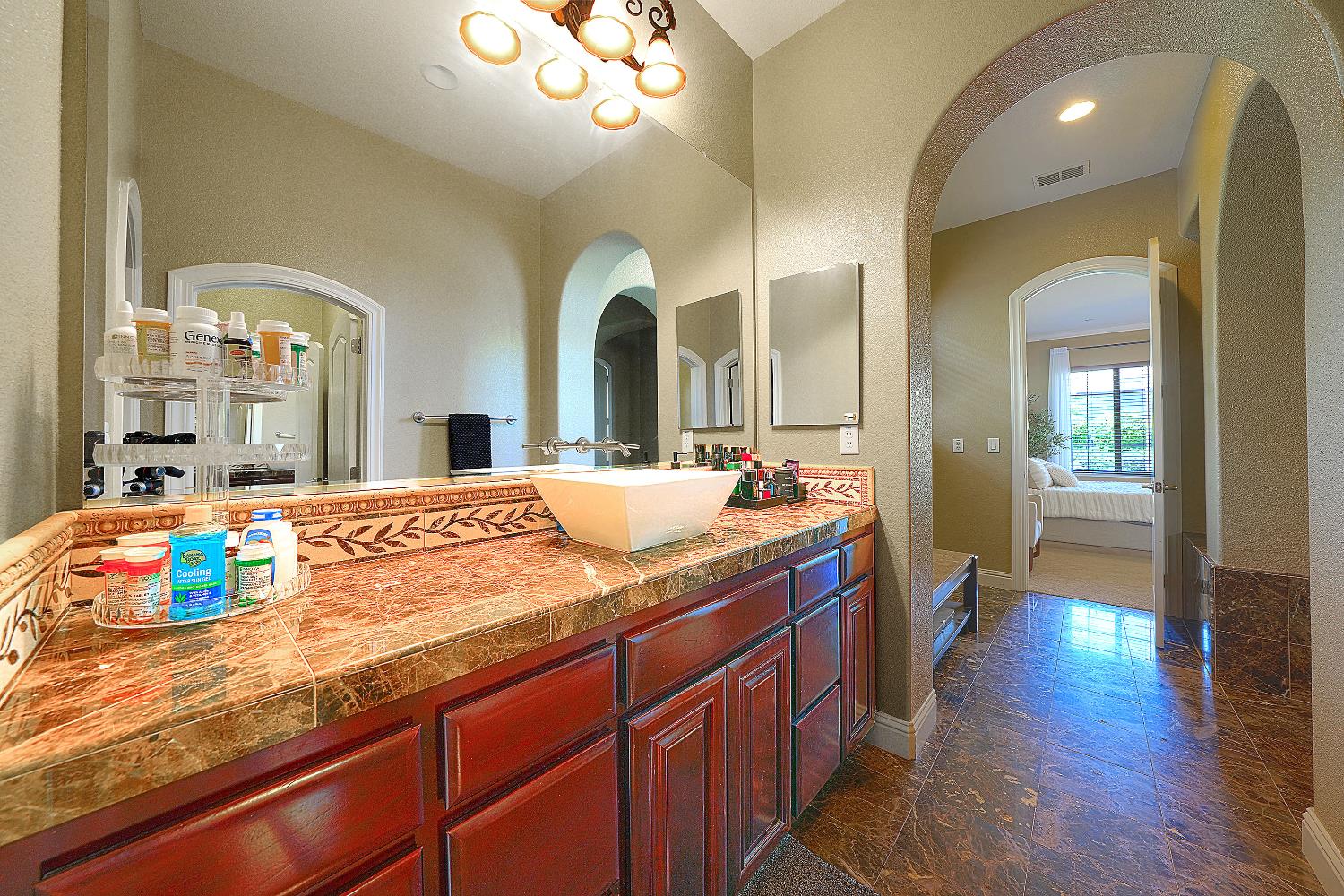 1340 Bella Circle Lincoln, CA 95648 - Photo 24 of 97 a bathroom with a sink a vanity and a mirror