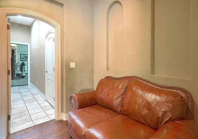 a view of a house with backyard and sitting area