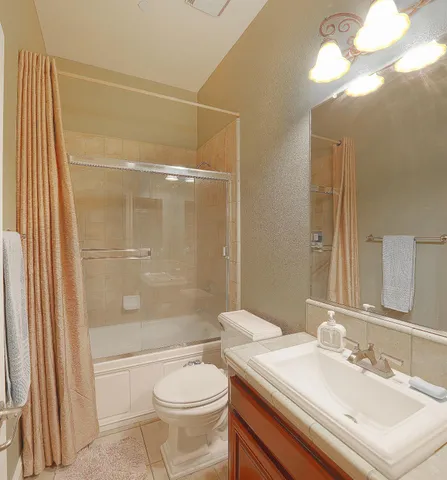 an aerial view of a house with a garden and lake view