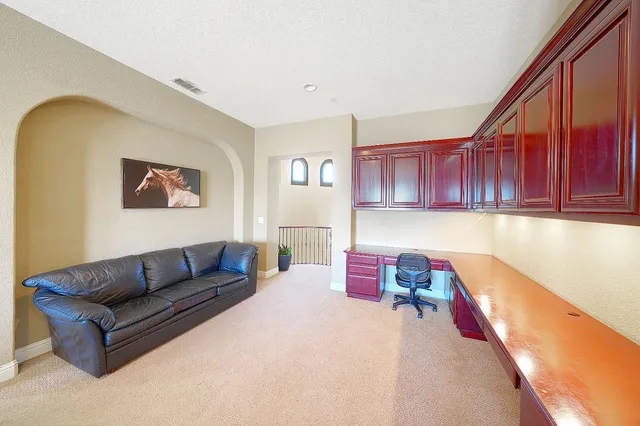 an aerial view of a house with a garden space