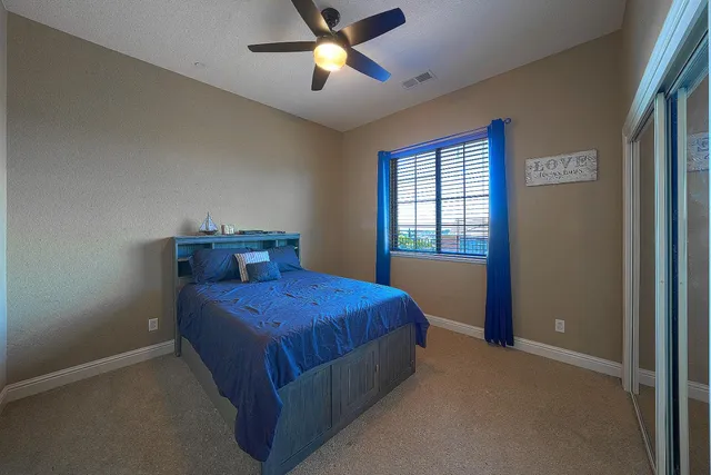 an aerial view of a house with a garden and plants