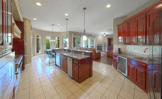 a bed room with a bed and a chandelier