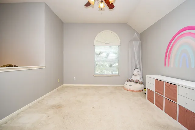 a view of room with window and wooden floor