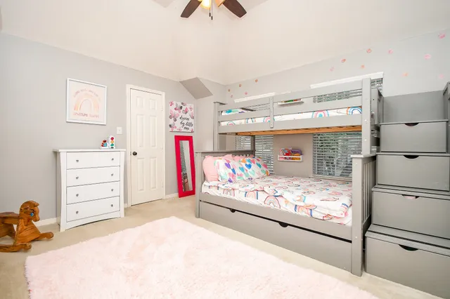 a bedroom with a bed and a closet