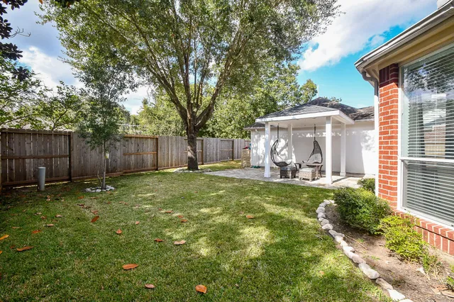 a view of a backyard with a small cabin