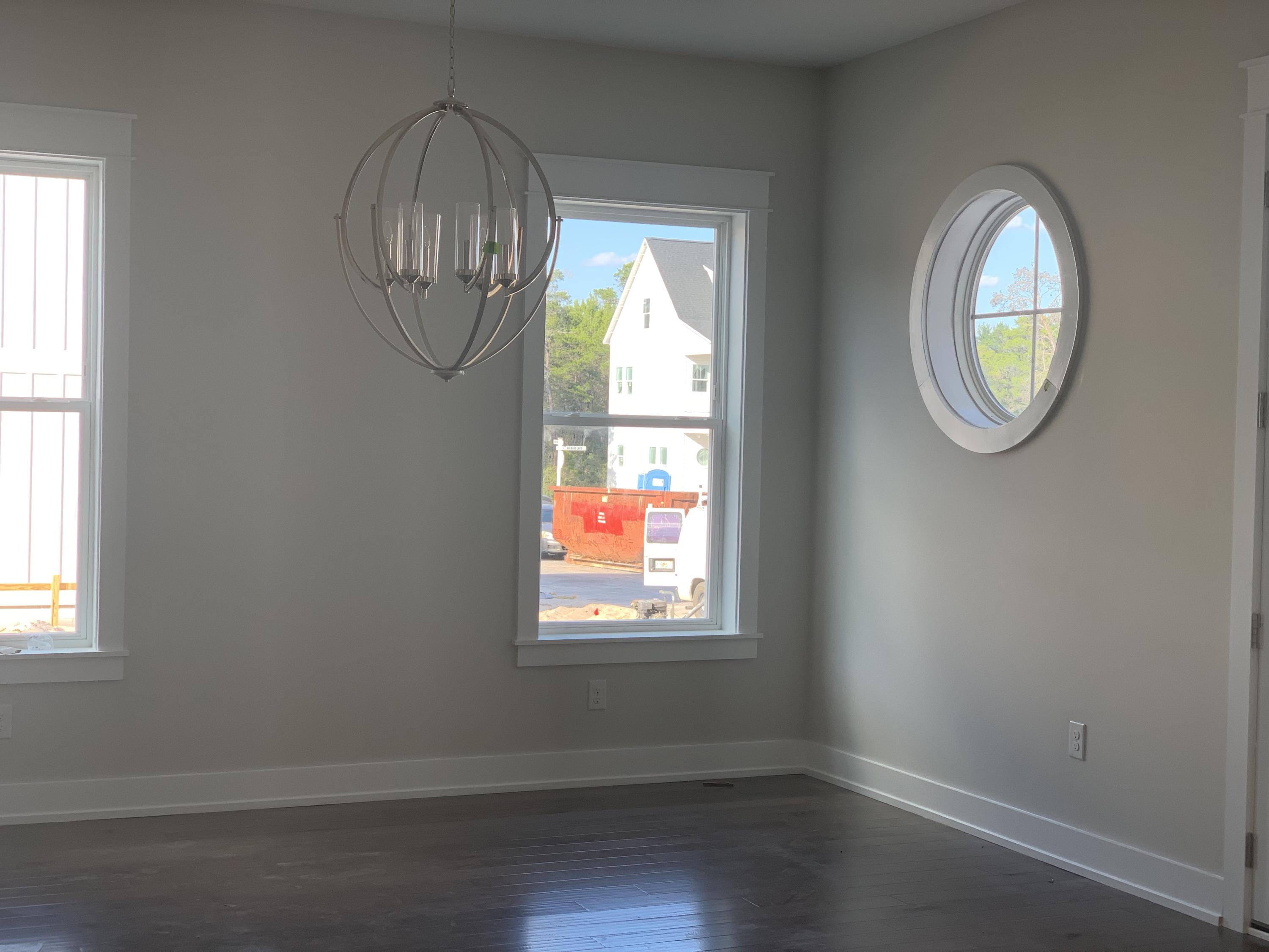 96 Beach View Dr Inlet Beach Inlet Beach, FL 32461 - Photo 4 of 13 an empty room with wooden floor and windows