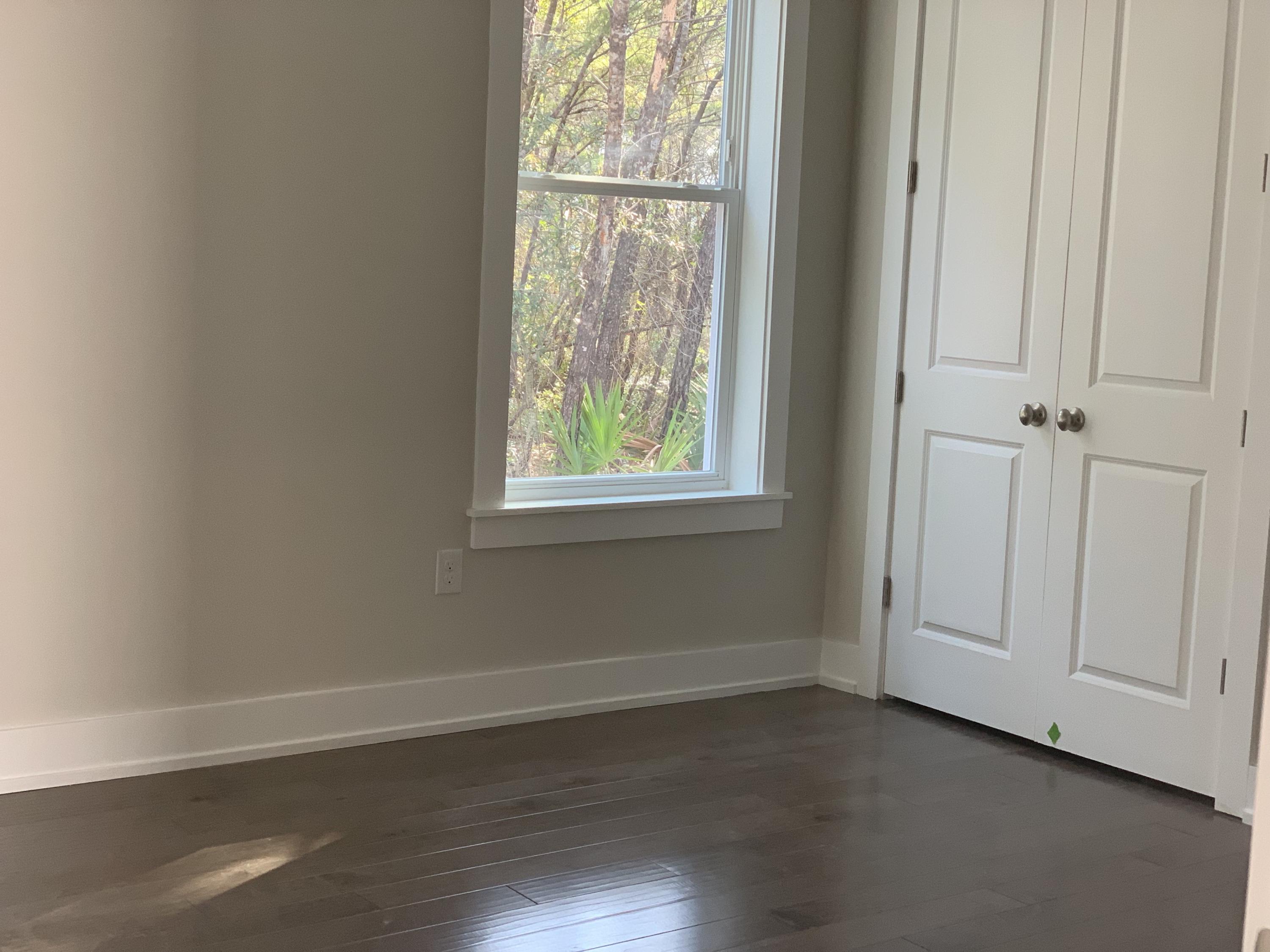96 Beach View Dr Inlet Beach Inlet Beach, FL 32461 - Photo 5 of 13 an empty room with wooden floor closet and windows