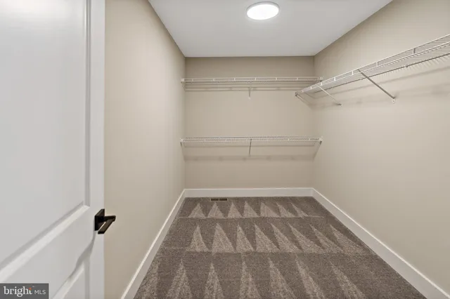 a view of a room with racks on the wall