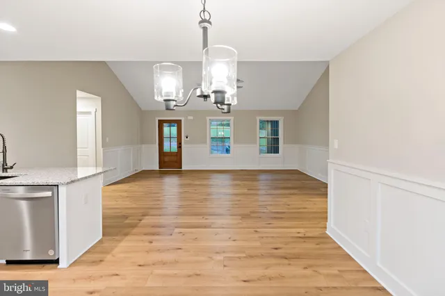 a view of a kitchen with wooden floor