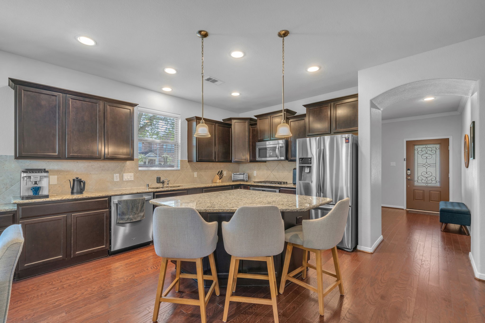 6427 Addlestone Ridge Lane Katy, TX 77494 - Photo 7 of 32 Spacious kitchen with granite counters and oversized island.