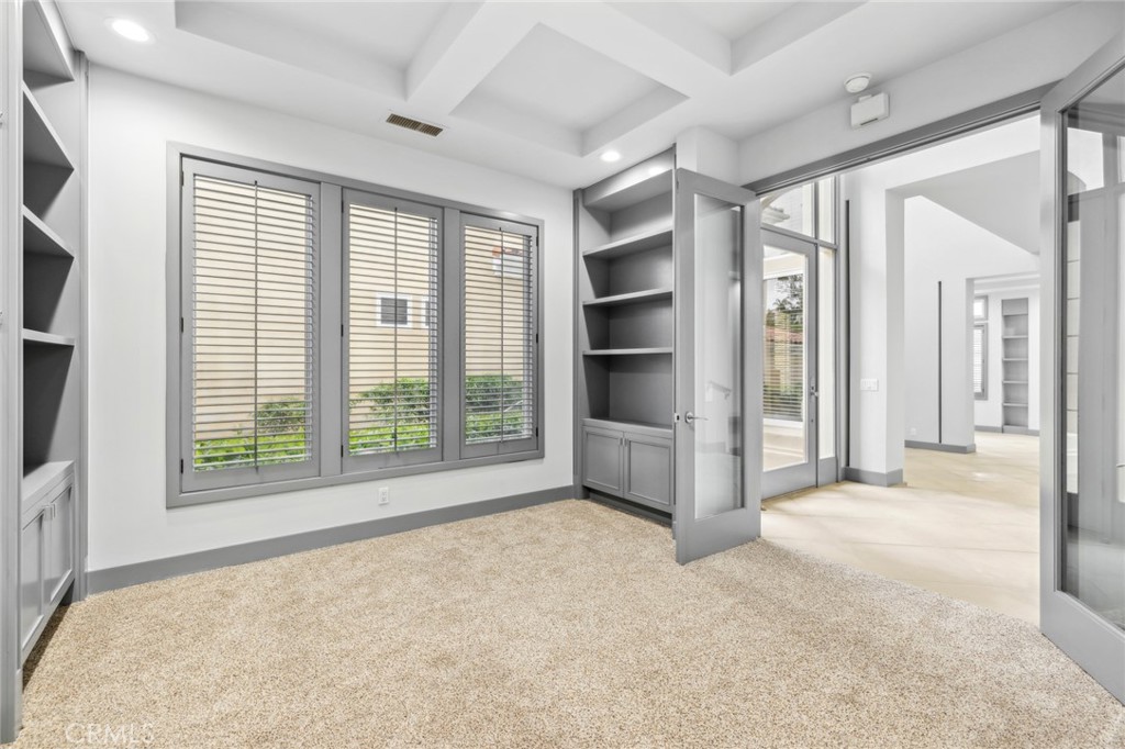 5 Torrey Pine Drive Newport Coast, CA 92657 - Photo 15 of 26 a view of an empty room with a fireplace and a window