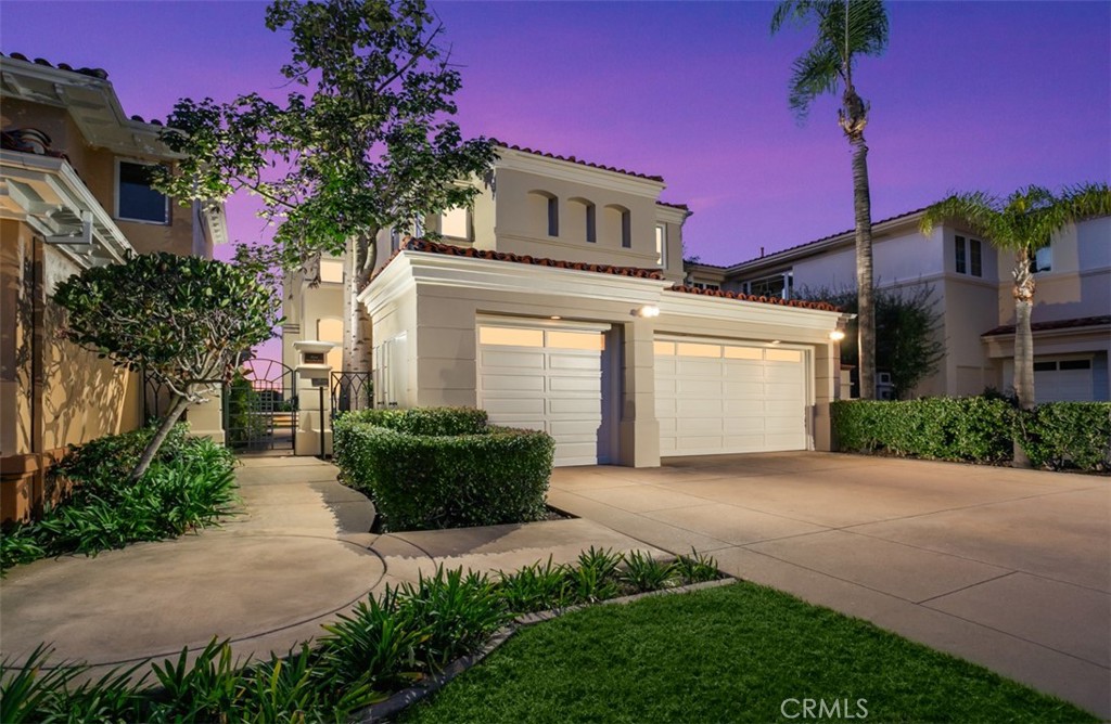 5 Torrey Pine Drive Newport Coast, CA 92657 - Photo 2 of 26 a front view of a house with a yard and potted plants