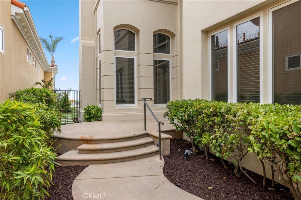 5 Torrey Pine Drive Newport Coast, CA 92657 - Photo 24 of 26 a front view of a house with garden