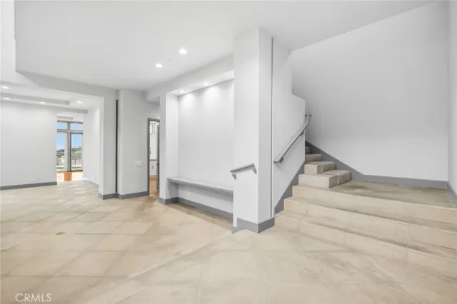 a view of entryway with stairs