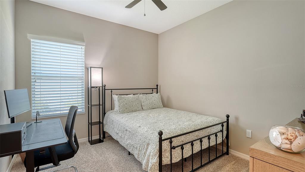 1318 Westover Avenue Parrish, FL 34219 - Photo 19 of 42 a bedroom with a bed and a desk